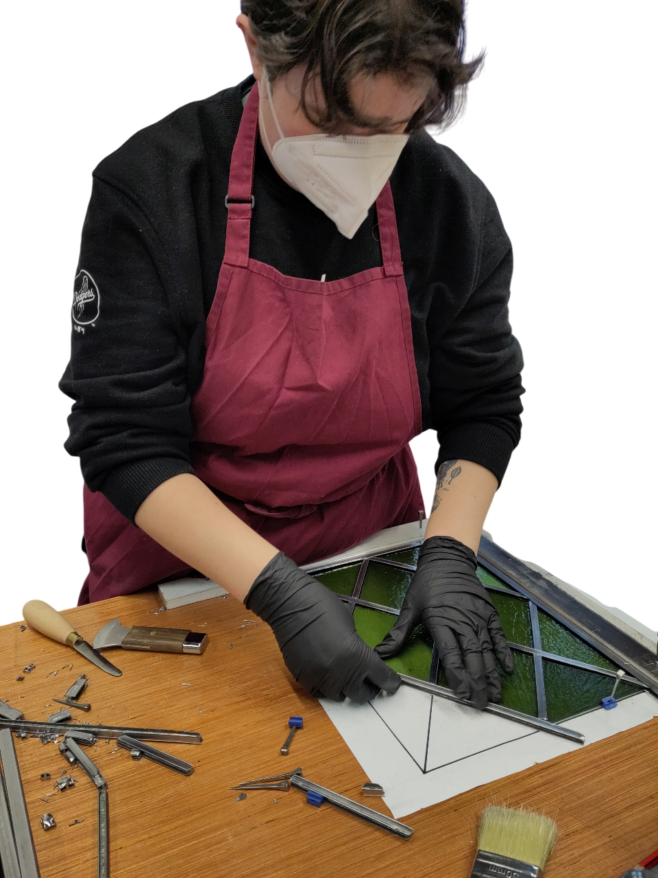 A photograph of the website author at work glazing a panel